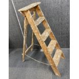 A vintage pine folding workman's ladder, H. 123cm.