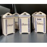 A set of 1930's kitchen ceramic spice boxes, H. 12cm.
