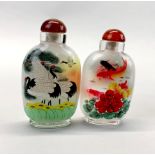 Two Chinese inside painted snuff bottles, H. 9cm.