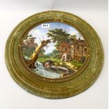 An interesting early 20th C framed hand painted porcelain panel, Dia. 44cm.
