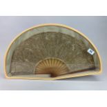 A cased early 20th C celluloid and gilt sequin fan, W. 62cm.