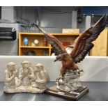 A G. Armani resin figure of an eagle, H. 33cm, together with a resin figure of three monkeys.