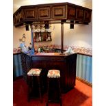 A large carved oak bar 5'6" x 4'5" and 7' high. Currently located in SS7 and will require