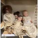 A group of four Victorian porcelain head dolls, including Armand Marseille.