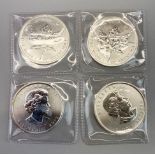 Four Canadian 1oz fine silver 2013 $5 coins.