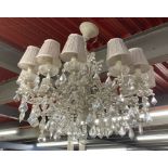 A large twelve branch metal and crystal drop chandlier light fitting, Dia. 82cm. D. 76cm.