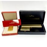 A boxed Dupont gold plated lighter, together with a boxed Shaeffer ballpoint pen set.