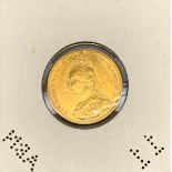 An encased 1893 gold sovereign.