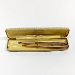 A Parker gold plated propelling pencil, and a further gold plated ball point pen.