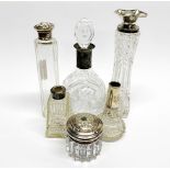 A group of cut glass dressing table bottles with silver and white metal mounts, tallest H. 19cm.