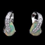 A pair of 925 silver earrings set with pear cut opals and white stones, L. 1.1cm.