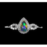 A matching 925 silver ring set with cabochon pear cut opal and white stones, (O.5).