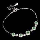 A 925 silver bracelet set with emeralds and white stones, L. 18cm.