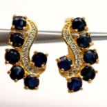 A pair of gold on 925 silver earrings set with sapphires and white stones, L. 1.9cm.