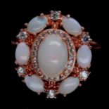 A rose gold on 925 silver ring set with cabochon cut opals and white stones, (N.5).