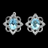A pair of 925 silver earrings set with oval cut blue topaz and white stones, L. 1.6cm.