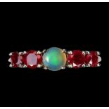 A 925 silver ring set with a cabochon cut opal and rubies, (N.5).