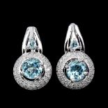 A pair of 925 silver earrings set with blue topaz and white stones, L. 1.9cm.