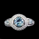 A matching 925 silver ring set with blue topaz and white stones, (O).