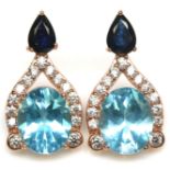 A rose gold on 925 silver drop earrings set with pear cut sapphires and oval cut blue topaz, L. 2.