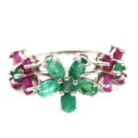 A 925 silver flower shaped ring set with rubies and emeralds, (N).