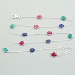 A 925 silver long necklace set with faceted ruby, sapphire and emerlad, L. 40cm.