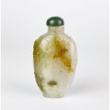A Chinese carved mixed colour jade snuff bottle decorated with flowers and foliage, H. 7.5cm.