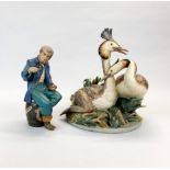 A Nao figure of a sailor, H. 27cm. Together with a large Lladro figures of two grebes, H. 34cm.