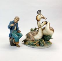 A Nao figure of a sailor, H. 27cm. Together with a large Lladro figures of two grebes, H. 34cm.