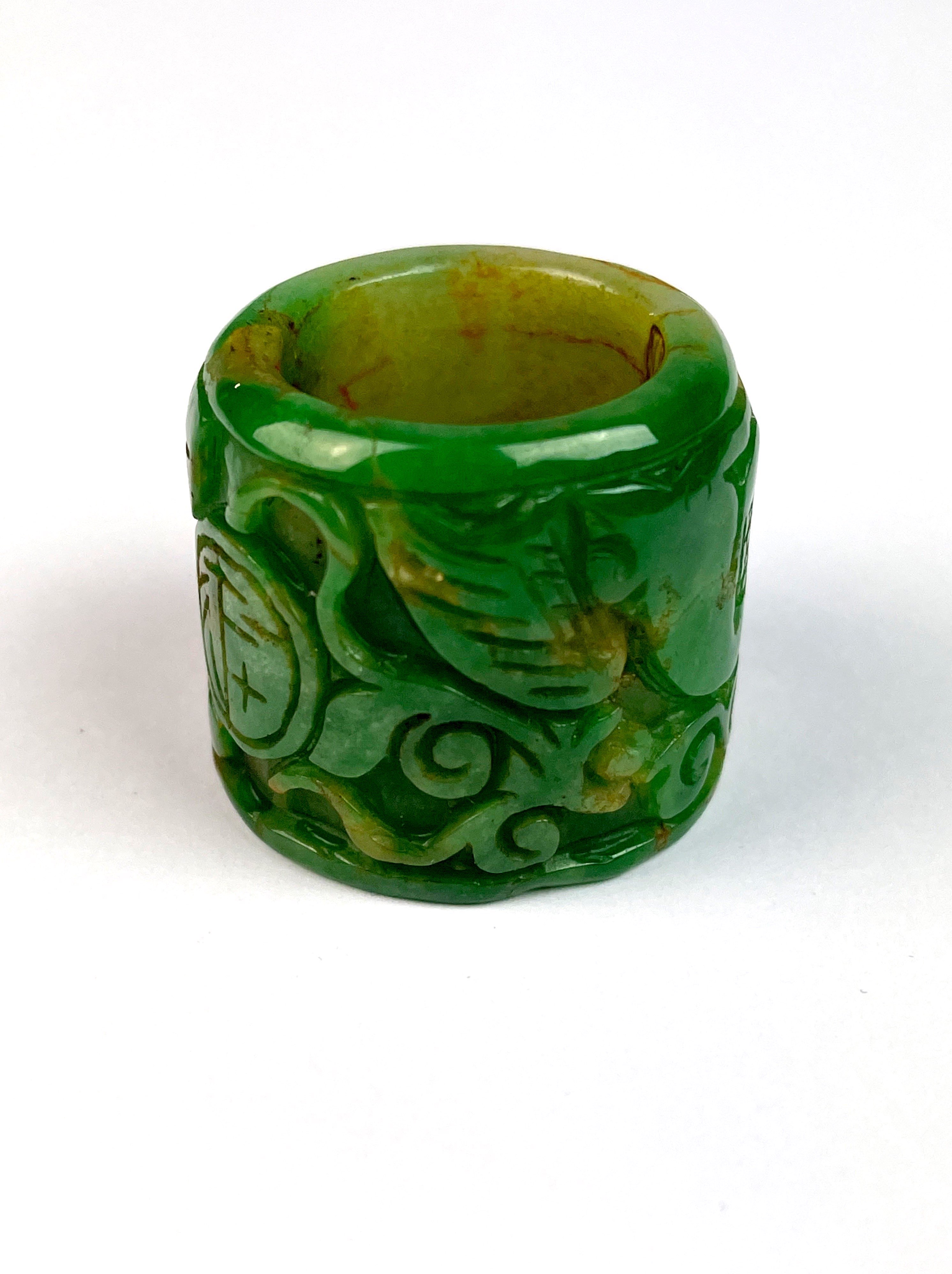 A Chinese carved green jade archer's thumb ring, W. 3cm. - Image 3 of 4