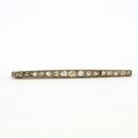 An antique yellow and white metal (tested high carat gold) Art Deco bar brooch (circa 1910-1920) set