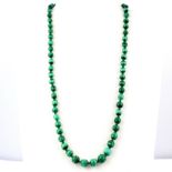 A necklace set with graduated malachite beads, L. 64cm.