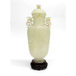 A superb Chinese finely carved nephrite jade vase and cover with carved wooden stand, overall H.