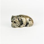 A Russian hallmarked silver model of a dog with ruby eyes, L. 6.5cm, H. 3cm.
