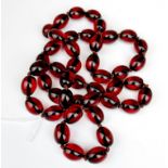 A strand of cherry faux amber beads, necklace L. 80cm.