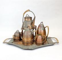 A hammered Sessessionist copper tea set. Spirit kettle overall H. 34cm, tray L. 55cm.