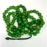 A strand of jade Buddhist prayer beads.