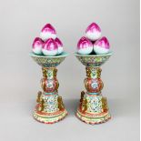 A pair of fine Chinese hand enamelled porcelain garnitures topped with peaches, H. 38cm.