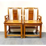 A pair of Chinese carved light elm scholars chairs, H. 96cm.