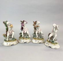 A group of four porcelain Capidomonte cherub figures, H. 16.5cm.