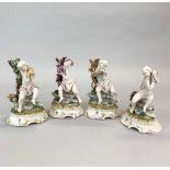 A group of four porcelain Capidomonte cherub figures, H. 16.5cm.