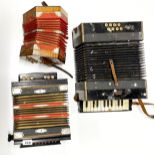 Three antique accordions.