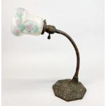 A 1920's cast metal and frosted glass desk lamp, H. 41cm.