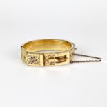 A Victorian rolled gold buckle bangle, L. 1.5cm. With replacement catch, not fully functional.