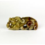 A Chinese carved jade figure of a young dragon, L. 10.5cm. H. 4cm.
