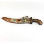A Tibetan tribal dagger with hammered copper hilt and scabbard inset with polished agate, L. 35cm.