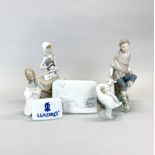 A group of four porcelain Lladro figures and two Lladro plaques, tallest H. 26cm.