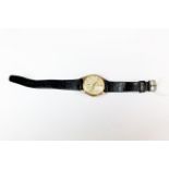 A gent's 9ct gold Omega manual wristwatch with 1959 engraving on the reverse. Appears to be in