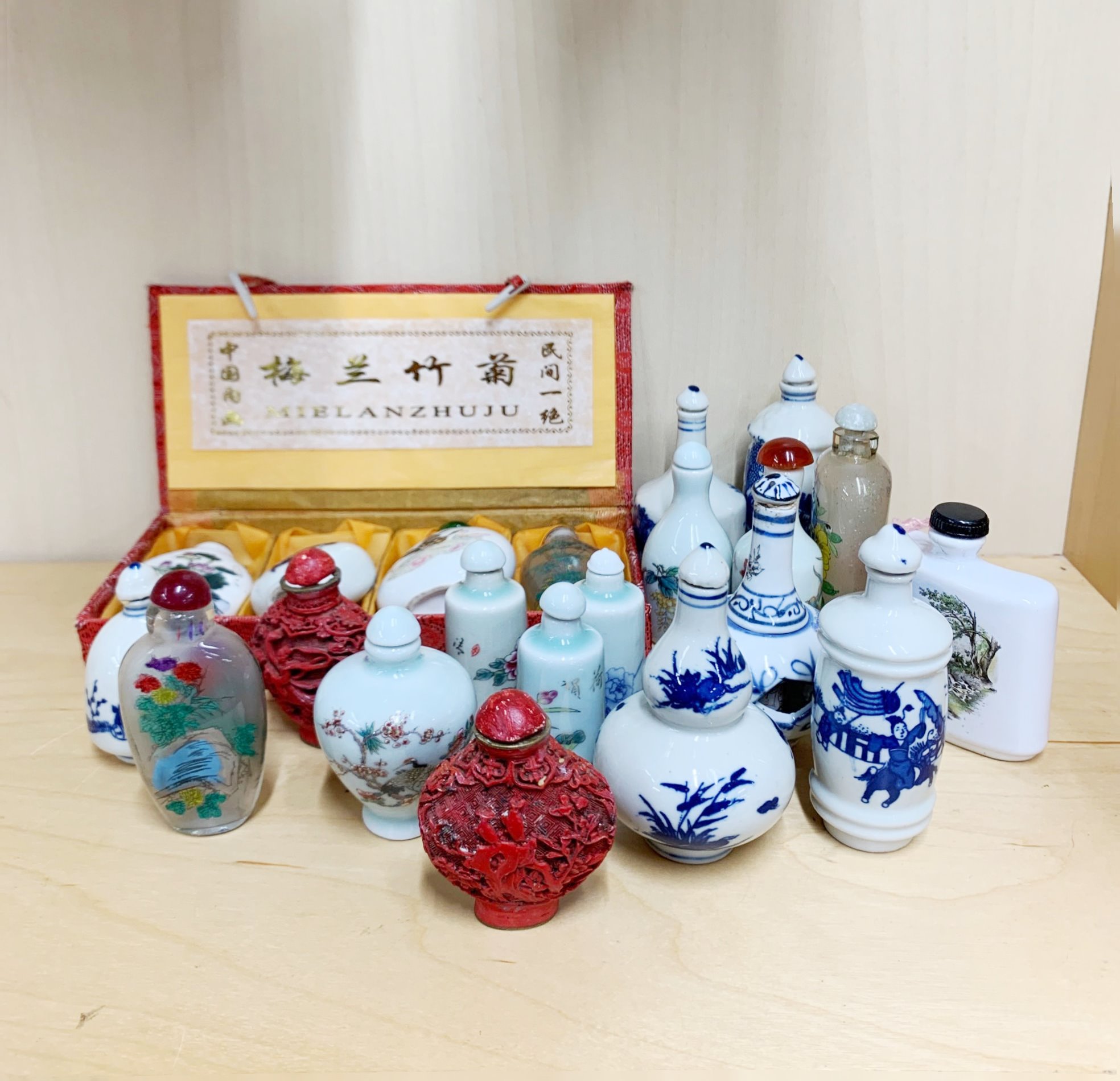 A collection of Chinese porcelain and other snuff bottles, tallest H. 10cm.