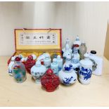 A collection of Chinese porcelain and other snuff bottles, tallest H. 10cm.